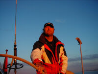 Skipper in red sunset